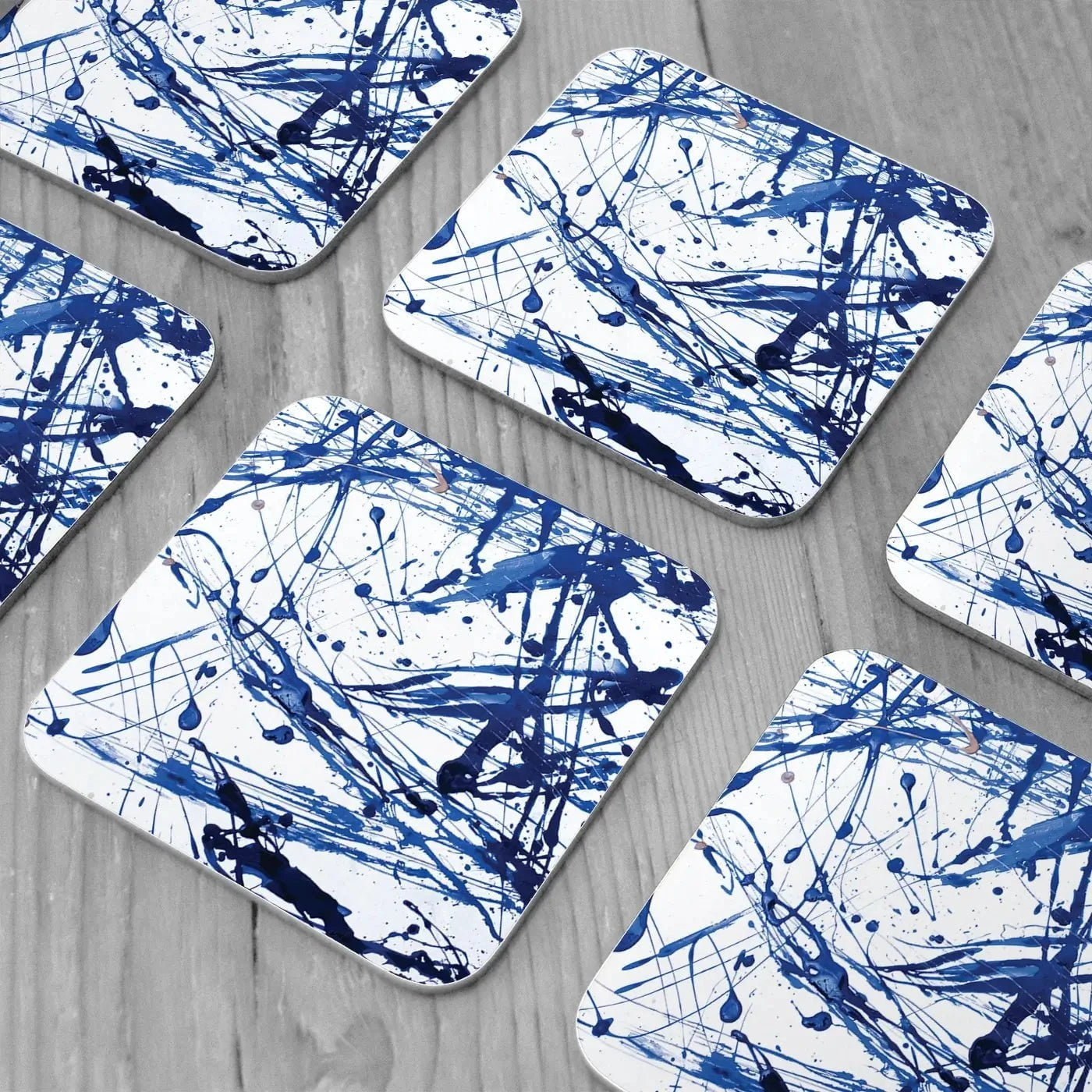 Blue Paint Spatter Coaster Set Blue Paint Spatter Coaster Set wall art product Nataliya Sdobnikova / Shutterstock