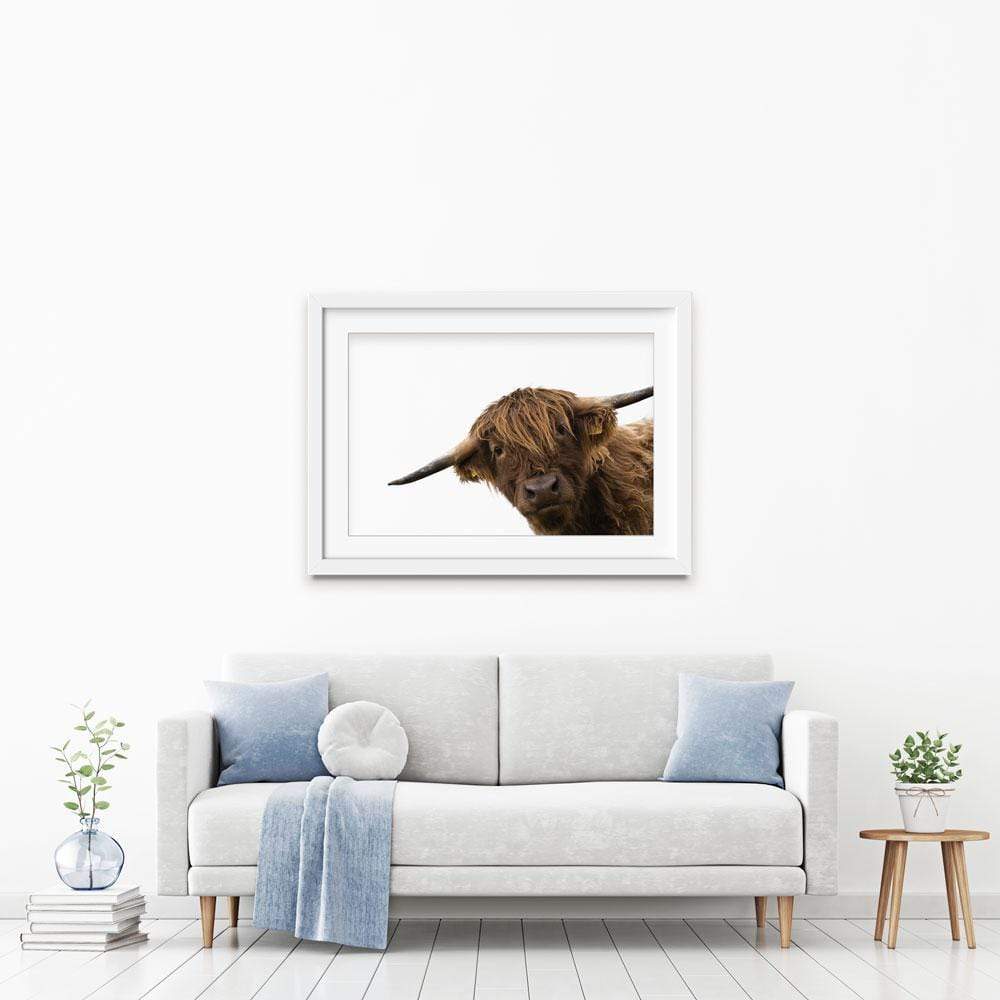Side Peeking Highland Cow Framed Art Print wall art product Massimo Cavallo / Shutterstock
