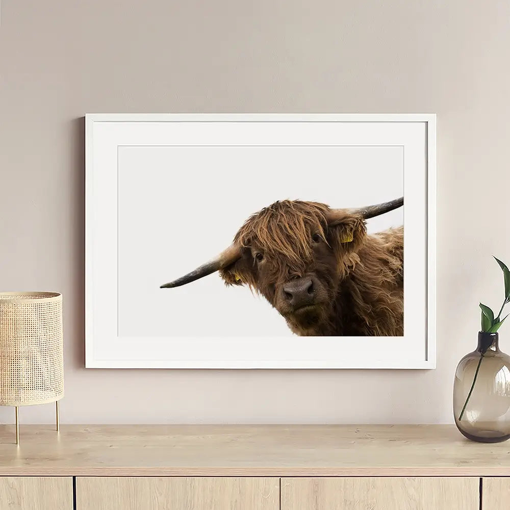 Side Peeking Highland Cow Framed Art Print Side Peeking Highland Cow Framed Art Print wall art product Massimo Cavallo / Shutterstock